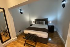 King Bedroom showcasing comfortable bedding and private en suite bathroom.