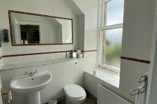 En suite bathroom in the king bedroom featuring modern fixtures and clean design.