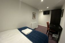 View of the spacious family treble room layout at Park View House Hotel with a double and single bed.