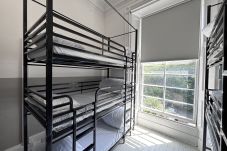 Cozy bunk beds in the 9-person female dorm at Haymarket Hostel, Edinburgh